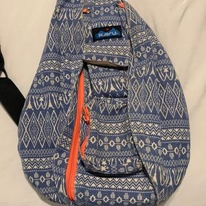 Kavu rope/sling backpack. Blue and cream with hot pinkish orange zipper.